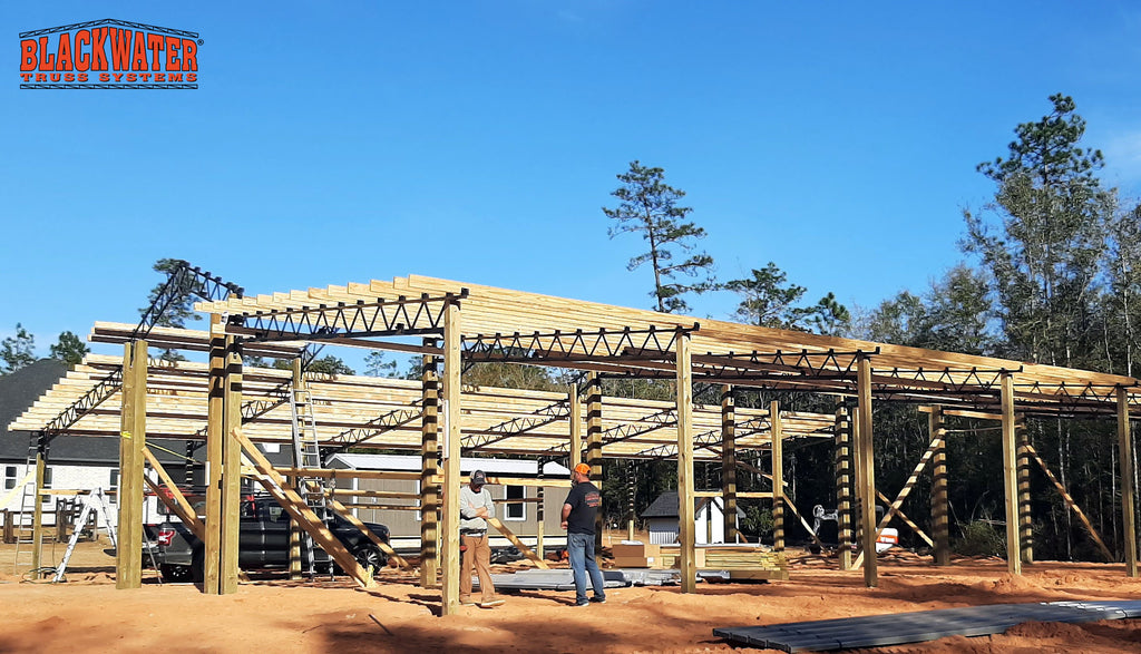 Open Pole Barn being Constructed with 2 lean-tos Built By Blackwater Truss Systems